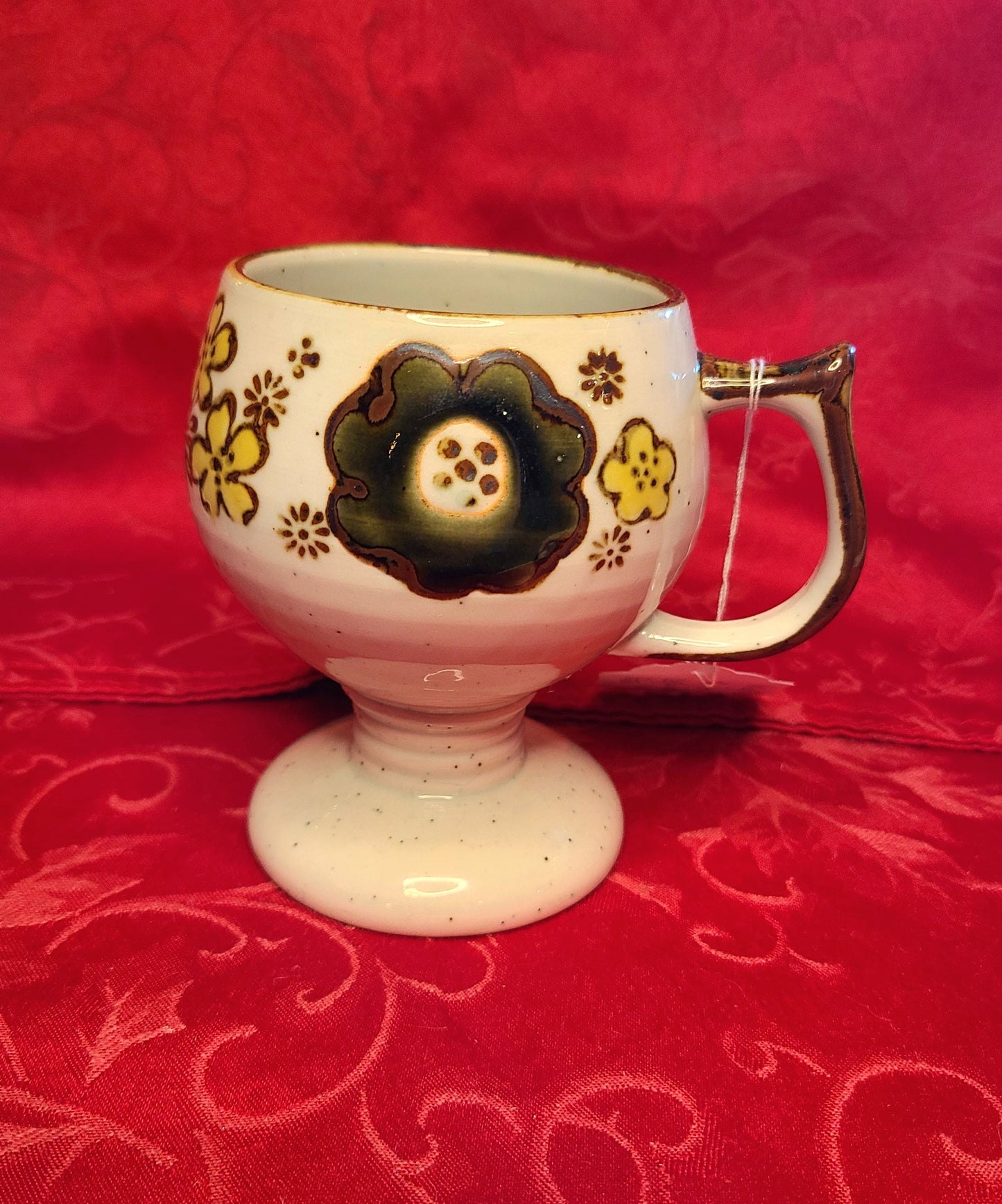 Vintage Pedestal Mug with Floral Design and Speckled Glaze