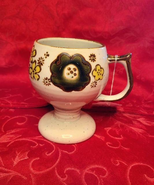 Vintage Pedestal Mug with Floral Design and Speckled Glaze