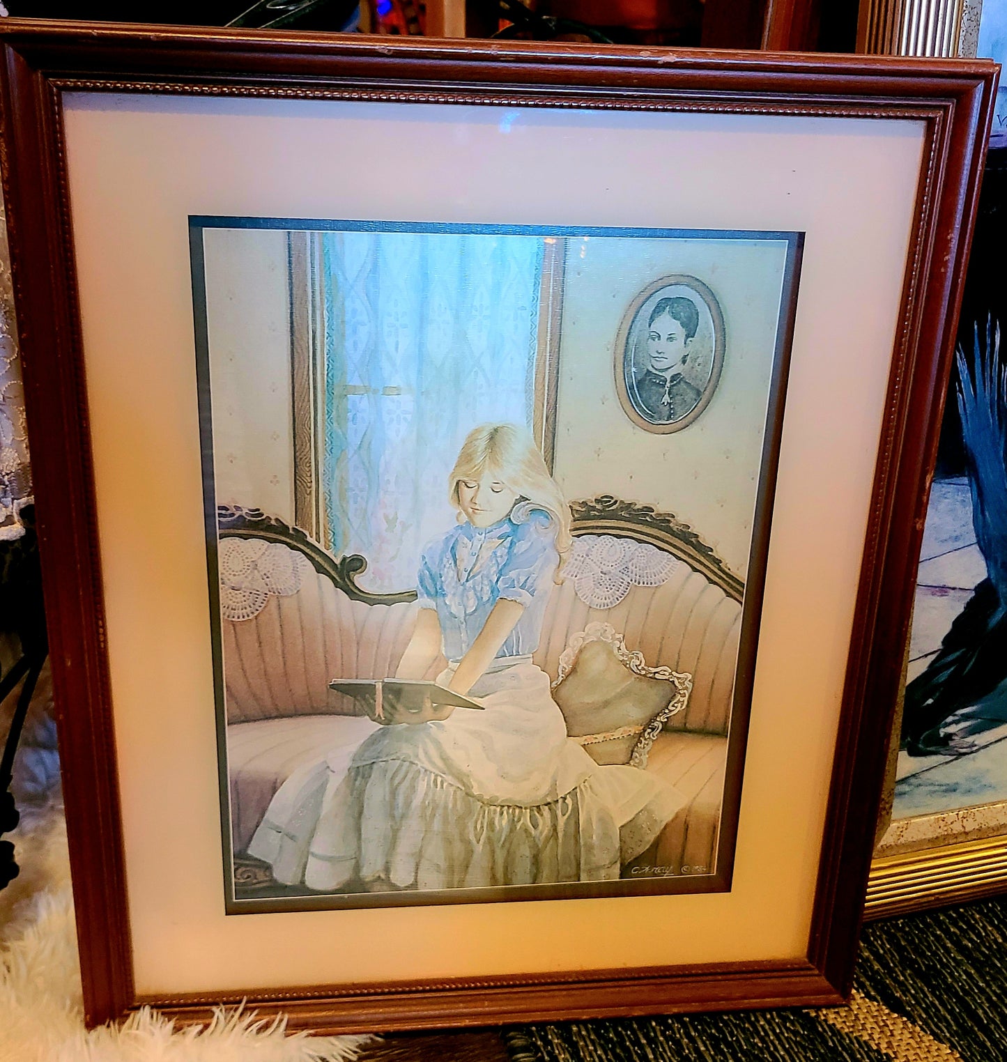 Vintage 1984 Framed Print by Artist C. Wray called "Girl on Antique Sofa Reading"